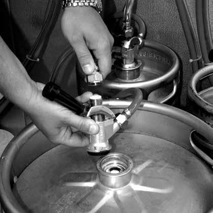Disconnect the clear beer line from the keg tap by loosening the appropriate beer nut (figure 2). Be careful not to lose the rubber washer inside the nut.