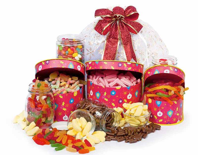 $35 $35 32 12 Lolly Tower Over 2kg of Sweet Treats packaged in a 3 tiered tower and presented in an organza bag with embossed Christmas ribbon.