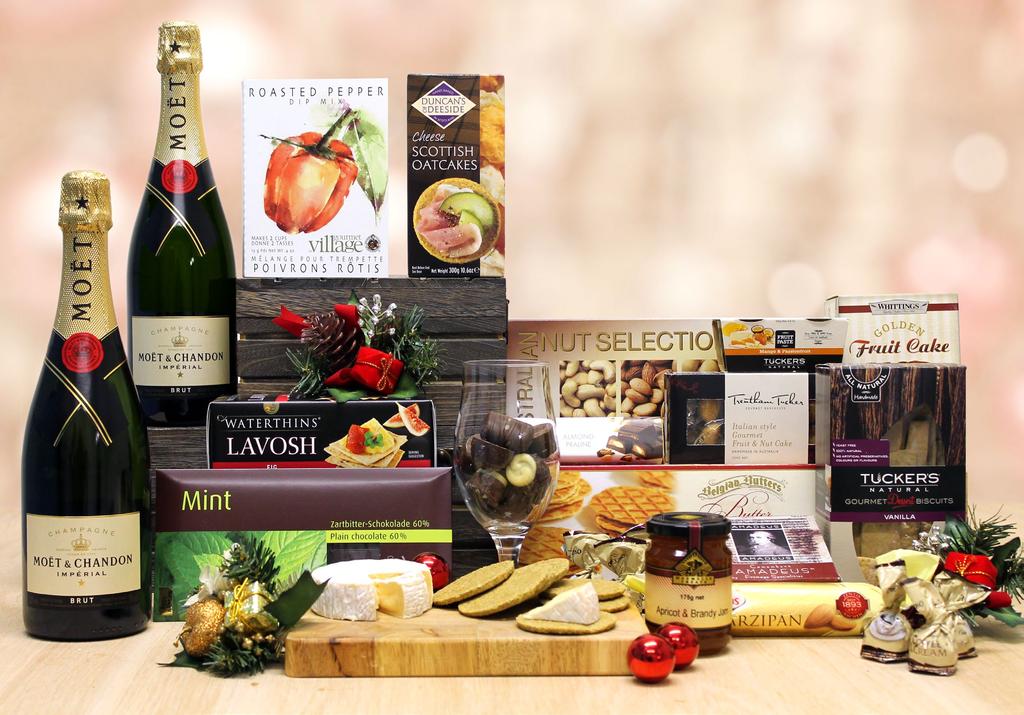 Grand Champagne Duet $350 This astounding gift features two bottles of Moët et Chandon Champagne, nestled amongst a magnificent assortment of epicurean foods, delightful desserts, zesty dips, dreamy