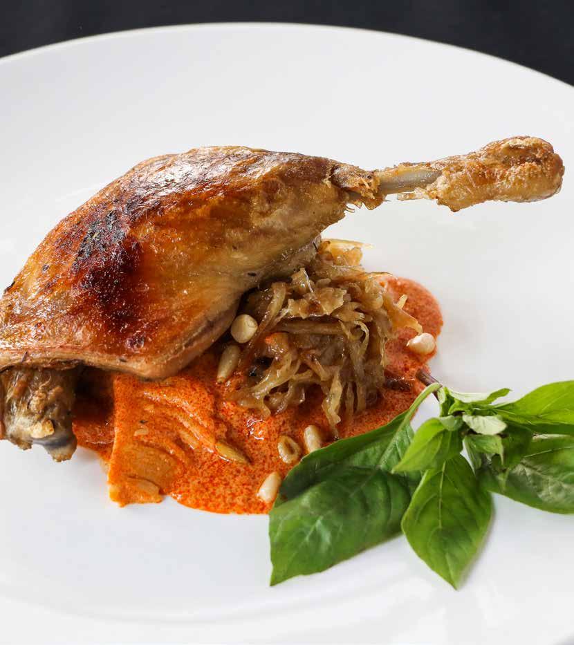 CONFIT OF DUCK, RED CURRY & FOREST BAMBOO SHOOTS Baked duck confit on a bed of rich red curry paired with stewed