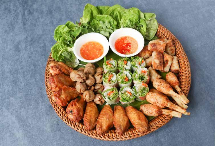 Bamboo Platters IndoChine platter Signature Bamboo Platters IndoChine platter (suggested for 6-8 persons) Rice paper poached tiger prawn rolls Signature seafood & chicken crispy spring rolls Charred
