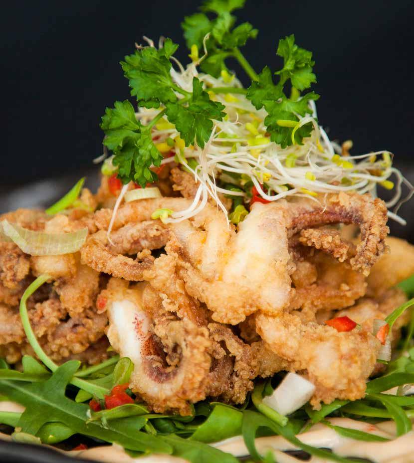 Crispy Squid with Spicy SalSA rosa & barbequed lime Crispy squid on wild rocket, served with spicy salsa rosa &