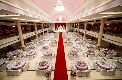 Celebrate your wedding in the unparalleled grandeur of our Grand Ballroom accentuated by the warm glow of the chandeliers.