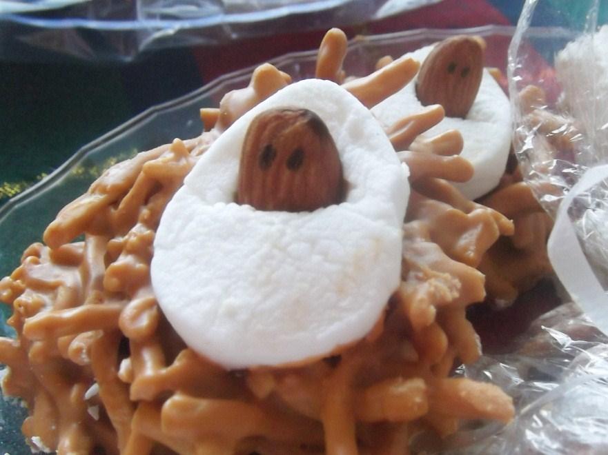 Haystacks Ingredients: 2 cup butterscotch chips 1 cup creamy peanut butter 4 cups chow mein noodles 12 large marshmallows 24 whole almonds Black Food Writing Marker* *I use Wilton brand (available in