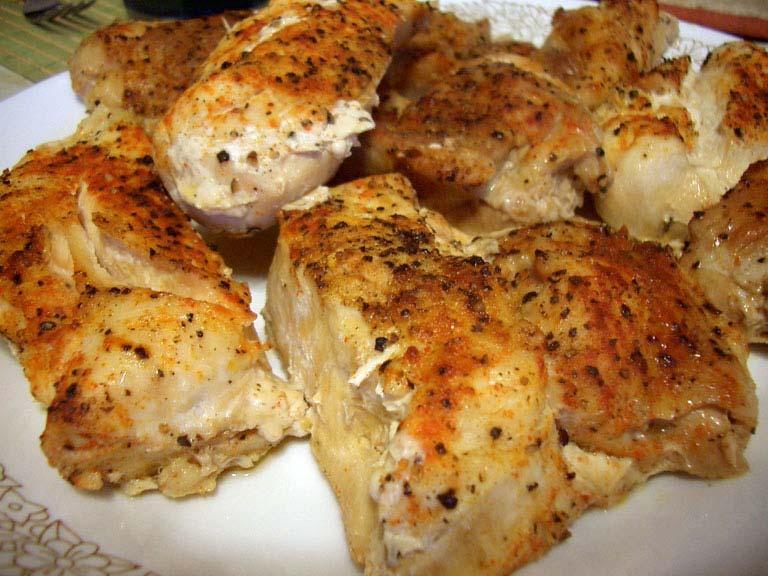 Spicy Baked Chicken 4 chicken breasts 1 onion cut up 2 cloves of garlic Creole Seasoning 1. Season Chicken 2. Place chicken into baking pan. 3.