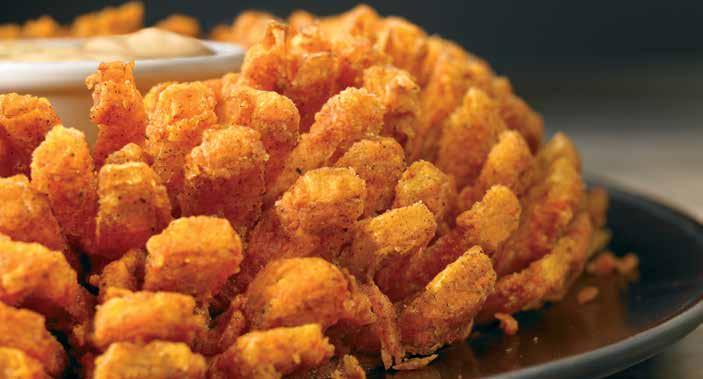 BLOOMIN ONION AUSSIE-TIZERS S BLOOMIN' ONION An Outback Original! Our special onion is hand-carved, cooked until golden and ready to dip into our spicy signature bloom sauce. (1950 calories) 8.