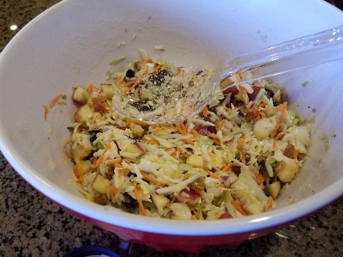 Apple Cranberry Coleslaw 14-16 ounces (1 bag) prepared coleslaw 2 ½ cups apple, unpeeled and diced ¾ cup red onion, finely diced 1 cup dried