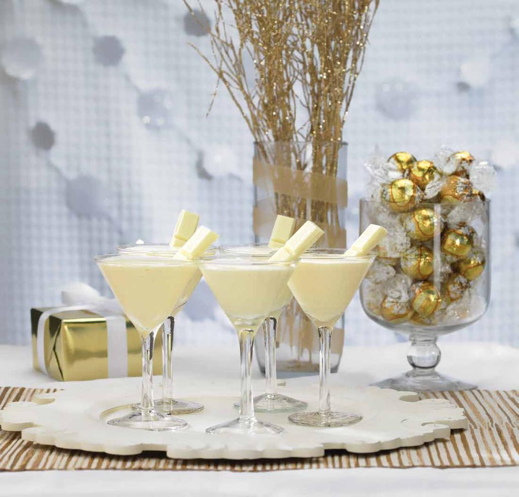 Divine White Chocolate Cocktail INGREDIENTS 6 squares of Lindt Classic Recipe White bar 2oz vanilla vodka 2oz crème de cacao 2oz heavy cream 4 ice cubes METHOD Chill 2 glasses Warm whipping cream and