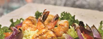 Paella Prawn Salad with Roasted Onions 3 quarts long grain rice, cooked 2 teaspoons turmeric ¼ teaspoon saffron 2 pounds red onions, unpeeled 2 tablespoons vegetable or olive oil 6 quarts mixed
