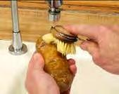 potatoes under cold tap water.