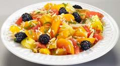 AMBROSIA SALAD Tart citrus fruit salad topped with blackberries, coconut, mint, and sliced almonds.