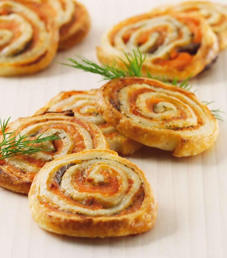 R Variations of «Aperitif nibbles» Salmon curls Ham palmiers roll of puff pastry roll of puff pastry 00 g smoked salmon, sliced bunch of dill, tips of leaves pulled off Spread the salmon out on the