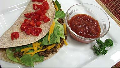 Per serving: 450 calories, 20 g fat, 61 g carbohydrate, 7 g fiber, 320 mg sodium Ground Beef Tacos 1 lb. ground beef Cooking spray 1 pkg. taco seasoning 4 whole-wheat tortillas Toppings: ½ c.