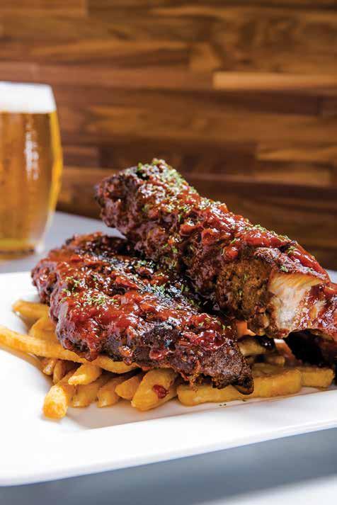 ENTREES BBQ Ribs $20.99 Chef inspired dry-rubbed pork ribs, slow roasted, char-grilled and covered in our chef s specialty raspberry chipotle BBQ sauce and served with a side of fries.