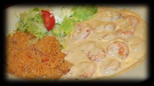 49 Grilled shrimp over rice. Topped with cheese sauce. Served with lettuce, sour cream and tomato. Shrimp Popeye $12.