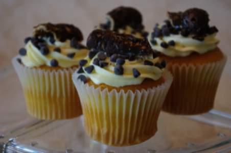Cannoli Golden Vanilla cupcake filled with homemade cannoli filling and topped with