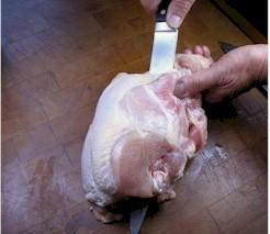5 4. Cut Carcass in Half Cut through the cavity of the bird from the tail end and slice through the