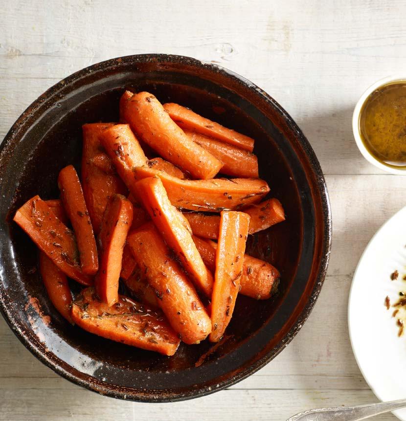 MUSTARD & HONEY CUMIN CARROTS Prep time: 15 minutes Cooking time: 40 minutes (Oven) -6 4-6 medium carrots, peeled and cut into pieces 40g butter 1 tbsp olive oil 3-4 stalks of thyme, chopped 1 tbsp