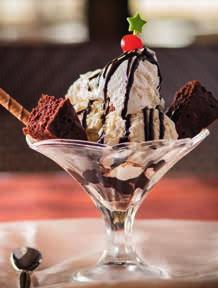 desserts Banana Split $4.95 Two scoops of ice cream served with a banana and your choice of chocolate, caramel or strawberry syrup and nuts topping. Brownie Sundae $4.