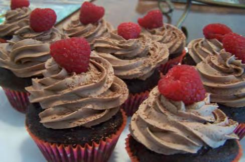 per flavor Assorted Cupcakes (gluten free and other flavors available) Chai Chocolate with raspberry jam filling and topped with chocolate butter cream, fresh raspberry and dark chocolate shavings.