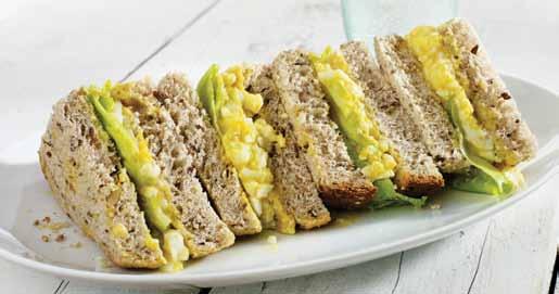 Light meals Curried Egg Sandwich Serves: 4 Preparation time: 10 minutes 4 hard boiled eggs, peeled 4 teaspoons low-fat natural yoghurt ¼ tablespoon curry powder pepper 4 lettuce leaves 8 slices