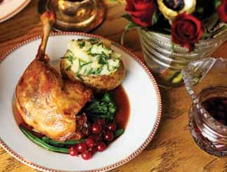 SERVES 2 Roast duck legs with redcurrant jus seasonal greens and a chive and olive oil jacket potato Ingredients: 2 Gressingham Duck legs 1 garlic clove 2 small baking potatoes - cleaned and wrapped
