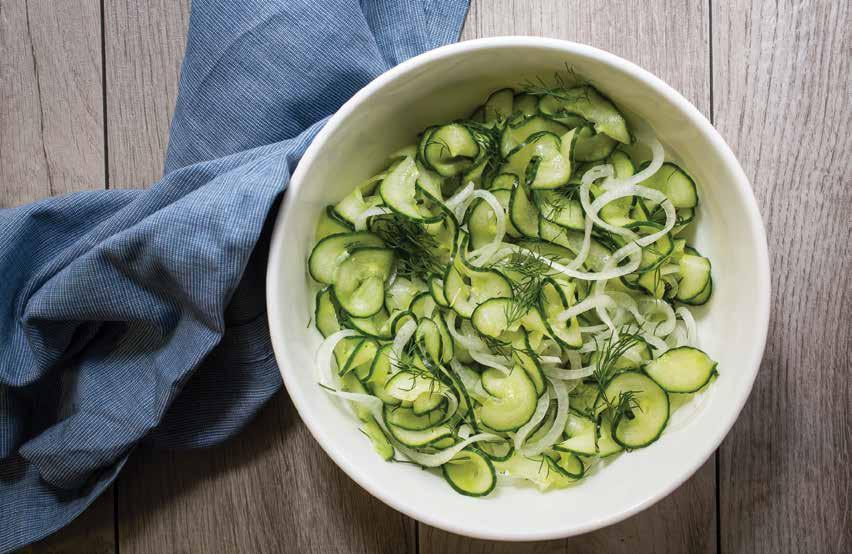 SIDES AND DESSERT Cucumber and Onion Salad 1 large English cucumber, ends trimmed 1 small yellow onion 2 tablespoons chopped fresh dill 3 tablespoons white wine vinegar ½ tablespoons water 1 teaspoon