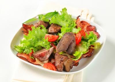 Liver & Bacon Serves: 4 4 large Tomatoes, scored 1 Red Onion, sliced 2 tbsp Olive Oil 1 crushed Garlic Clove 8 smoky Bacon Rashers 4 x125g slices of Calves Liver 1.