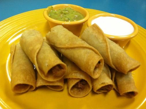 49 Taquitos Platter: Tasty chicken meat, wrapped up in golden and crispy corn tortillas, with sour cream and guacamole on the side to give them that extra delightful flavour.