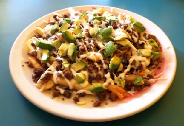 49 Savory Nachos: Crunchy corn tortilla chips with meat, cheese, beans, sour cream, avocado, tomato, and jalapeños...$9.