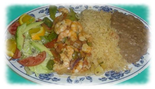 49 Camarones al Mojo de Ajo: Succulent grilled shrimp in our special garlic sauce. Served with our delicious rice, beans, a small salad and warm tortillas...$15.