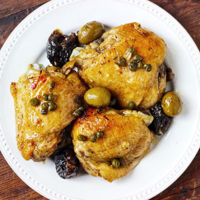 Chicken Marbella Active Time: 10m Total Time: 35m 3 cloves garlic 8 chicken thighs, boneless and skinless 2 tablespoons extra virgin olive oil 1/4 cup balsamic vinegar 1/4 cup red wine vinegar 3