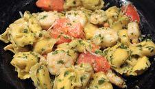 Seafood pesto shrimp tortellini California Scampi Shrimp, scallops and mussels sautéed with garlic, mushrooms, diced tomatoes, baby spinach and lemon butter.