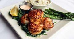 $38 Chesapeake Bay Crab Cakes Two crab cakes of seasoned lump crabmeat, panko breaded and pan-seared, served with Creole remoulade. Choice of two sides.