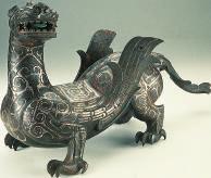 To get enough soldiers, they issued laws forcing peasants to serve in the army. The armies fought with swords, spears, and This statue of a winged dragon is from the Zhou dynasty.