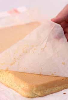 Turn the warm swiss roll out onto the sugar sprinkled paper.