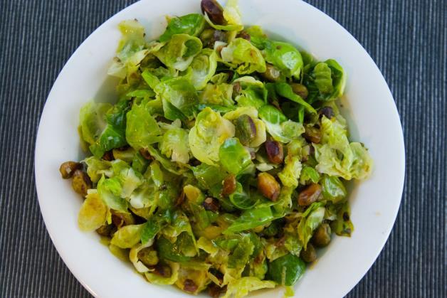Brussels Sprouts with Pistachios and Lemon [Serves 4] 2 tablespoons extra virgin olive oil ¾ cup shelled pistachios Zest and juice from one lemon 16 large brussels sprouts, leaves separated from the