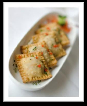 Savory mini cones filled with a creamy blend of spices & roasted vegetables Chaat Papdi Canapé A bite sized wafer topped with