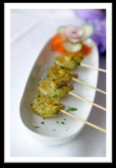 curry mayo, served on crisp crackers Tava Machchi Canapé Griddle-seared tilapia nuggets served on a bed of