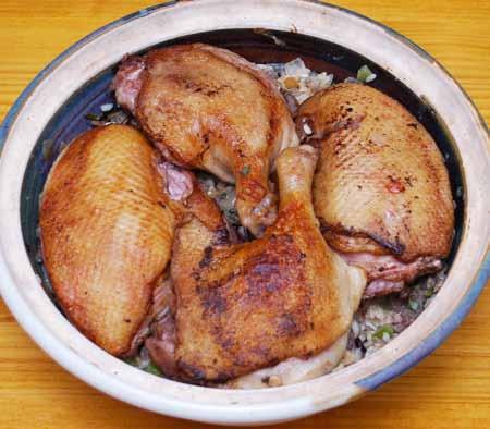 Add the chopped sage and mix well. Press into the bottom of a deep casserole dish and arrange the duck pieces on top.