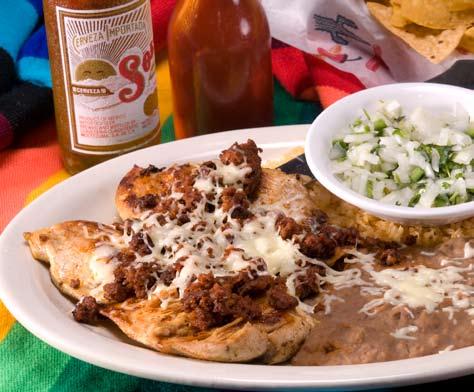 00 Steak Ranchero Steak cooked and topped with onions and our special sauce. Served with rice, beans and tortillas 10.