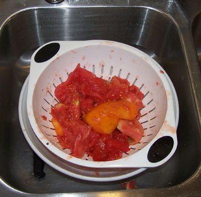Step 7 - Drain the tomatoes Toss the squeezed (Squozen? :) tomatoes into a colander or drainer, while you work on others. This helps more of the water to drain off.
