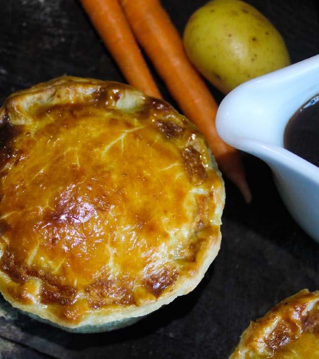 in a rich gravy with chunks of British potatoes encased in hot water crust pastry The Saucy Cow Tender pieces of lean Welsh Beef soaked in Gower Power Ale wrapped in a boiled pastry case.
