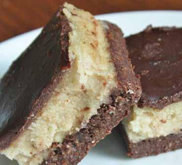 Chocolate Cheesecake Bars 1½ cups almonds 1 cup dates (soaked 30 minutes and drained) ¼ cup cocoa powder Place almonds into a food processor and process until broken down into a bread crumb like mix.