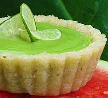 Lime Mousse Tart 2 cups macadamia nuts 1 cup desiccated coconut ¼ cup honey 2 tablespoons lime zest 2 tablespoons lime juice Place the macadamia nuts in food processor and blend until broken up but