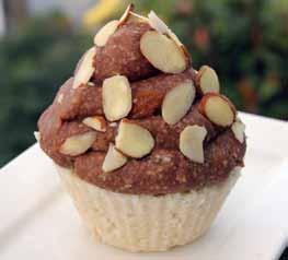 Almond Cupcakes with Chocolate Almond Frosting 3 cups peeled and chopped apples 2 cups desiccated coconut ¼ cup honey 1 teaspoon almond essence Place the chopped apples in a food processor and