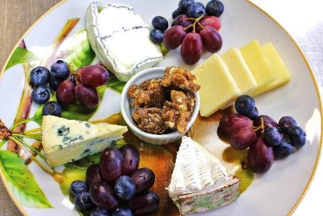 With four local cheeses, candied nuts, crackers, and a seasonal fruit