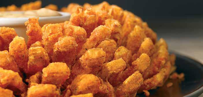 BLOOMIN ONION AUSSIE-TIZERS S BLOOMIN' ONION An Outback Original! Our special onion is hand-carved, cooked until golden and ready to dip into our spicy signature bloom sauce. (1950 calories) 8.