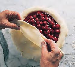 Seal the edges together firmly and trim excess dough. An easy way to do this is to press the rim with the tines of a fork. Alternatively, the rim may be fluted.