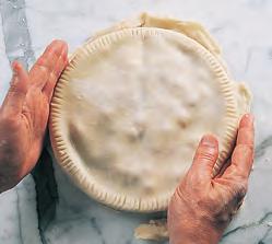 Sprinkle with granulated sugar if desired. 8. Place the pie on the lower level of an oven preheated to 425 to 450 F (220 to 230 C). The high initial heat helps set the bottom crust to avoid soaking.